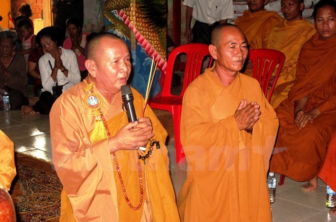 OVs in Cambodia offer incense to martyrs