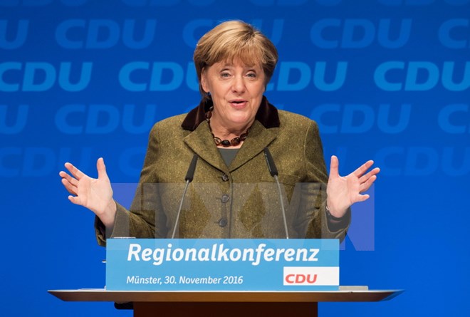Angela Merkel wins re-election as Chair of CDU Party