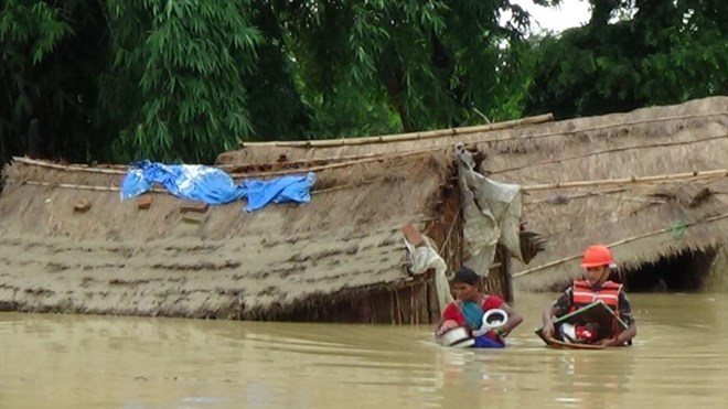 Flooding and landslides kill at least 90 in India and Nepal
