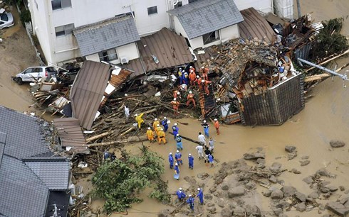 Flooding and landslides in Japan leave at least 100 dead