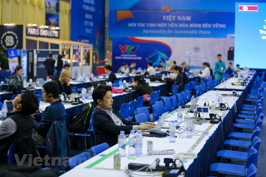 Reporters work by night at International Media Center