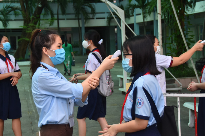 Ho Chi Minh city 150,000 students of grade 9 and 12 eager to return school