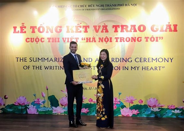 First prize of writing contest on Hanoi presented to Palestinian contestant