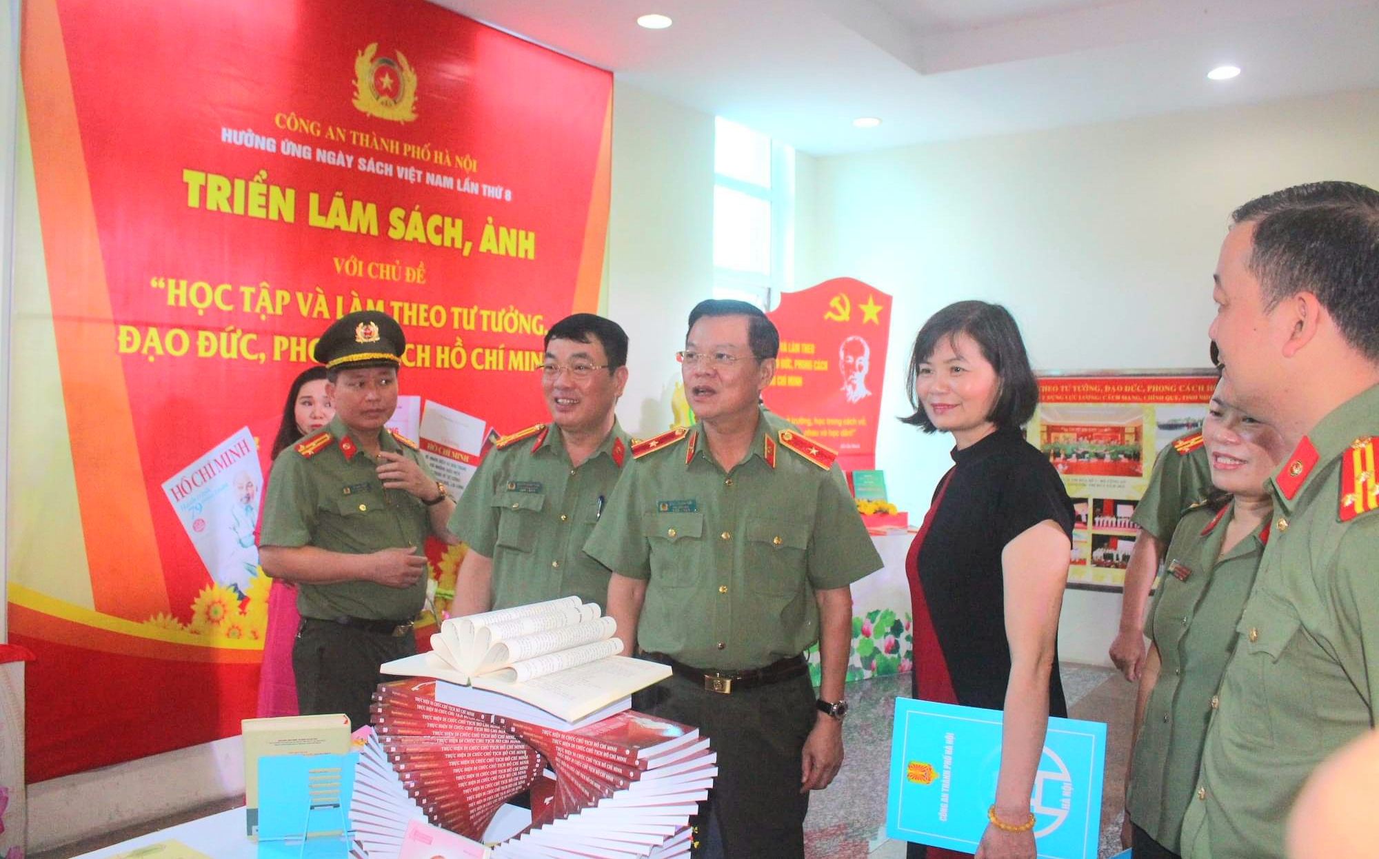 Books and photos about studying and following Ho Chi Minh s ideology, morality and style display
