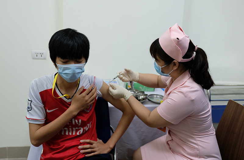 First six volunteers receive second shots of second local COVID-19 vaccine trials