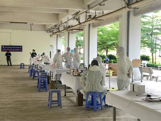Workers in a current hotspot of COVID-19 receive vaccinations