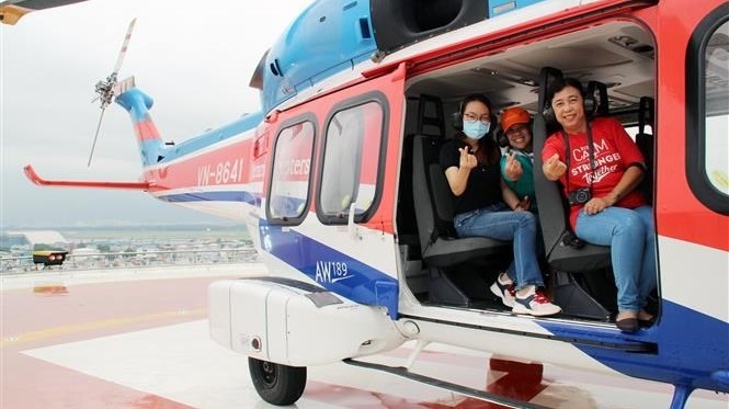 First helicopter tour over HCM City carries 30 passengers