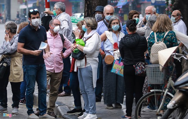 COVID-19 Les visiteurs étrangers confiants en les mesures prises par Hanoi
