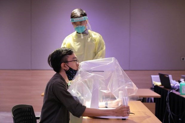 Singapour développe avec succès un robot d échantillonnage du COVID-19