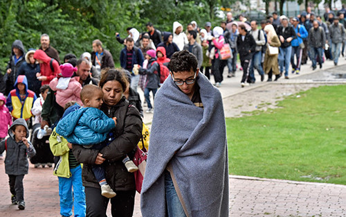 联合国报告说全球难民和流离失所者逾6000万