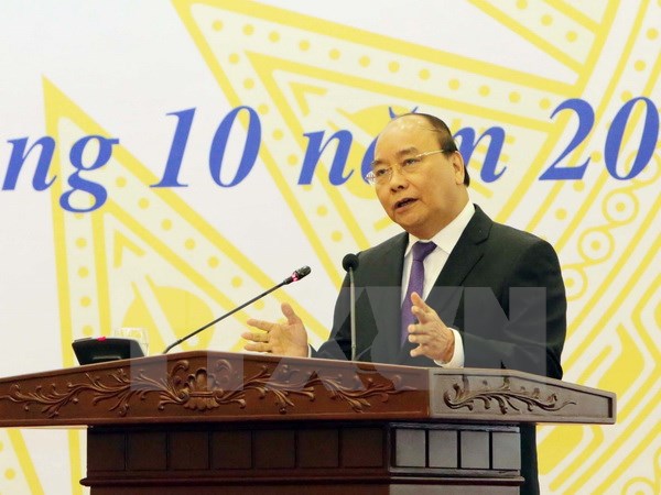 越南政府总理阮春福：对越南社会政策银行及贫困者的投资是以投入促发展的活动