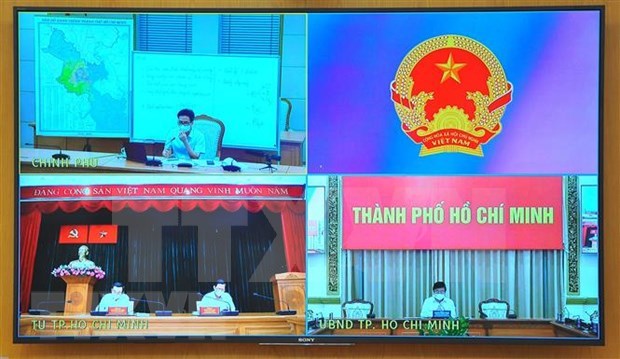 政府副总理武德儋主持与胡志明市的新冠肺炎防控视频会议