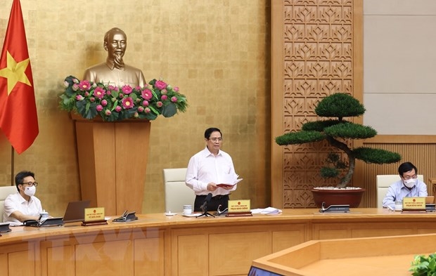 范明正总理要求胡志明市与周边省份协调确保生产安全和民众健康安全