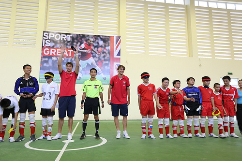 Arsenal players play football with visually impaired children in Hanoi