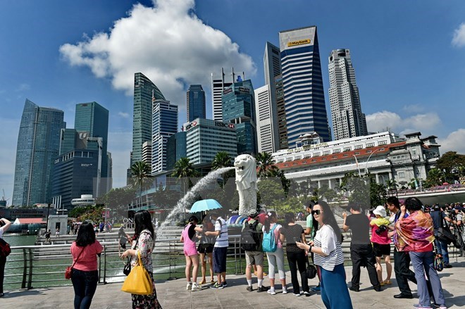 Singapore’s ruling party, opposition unveil election manifesto
