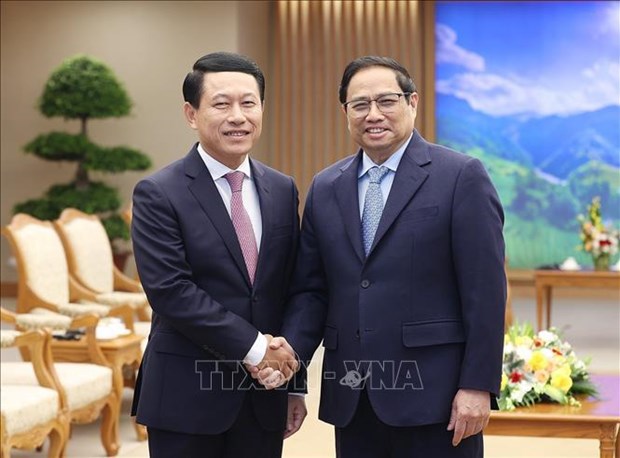 PM Pham Minh Chinh receives Lao Deputy PM, Foreign Minister