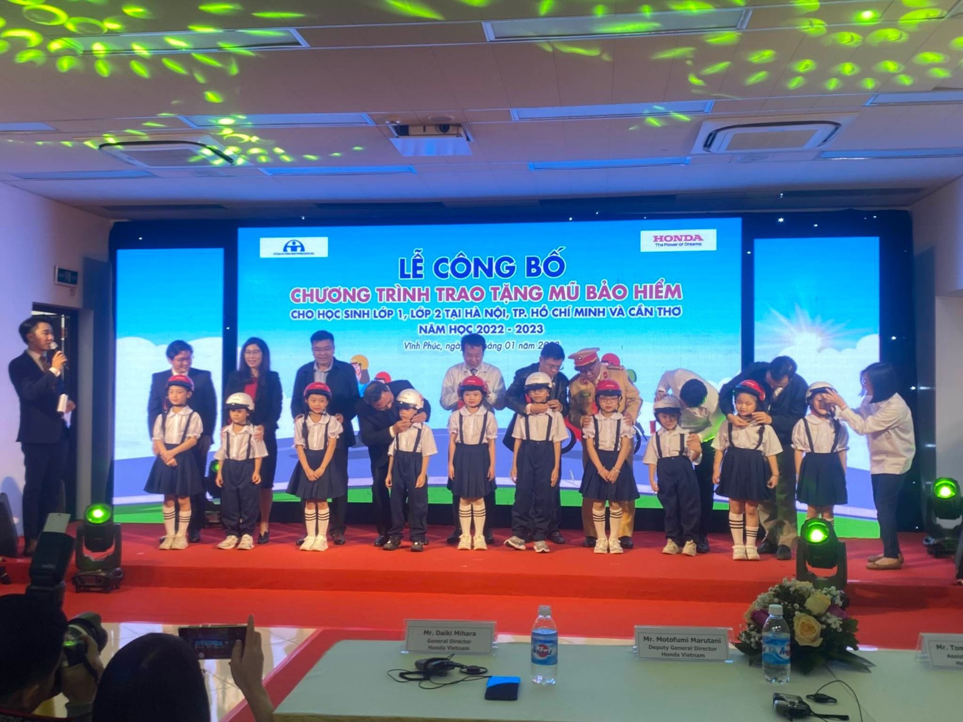 Presenting helments to 620,000 students in three localities