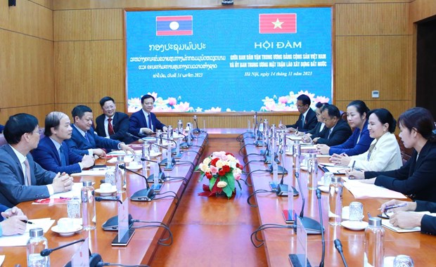 Vietnam, Laos to step up sharing mass mobilisation experience