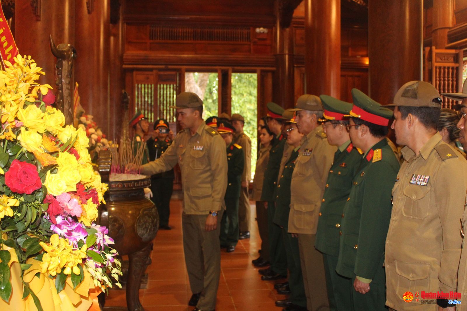 Young officers of Cuban Ministry of Revolutionary Armed Forces offer incense to commemorate President Ho Chi Minh
