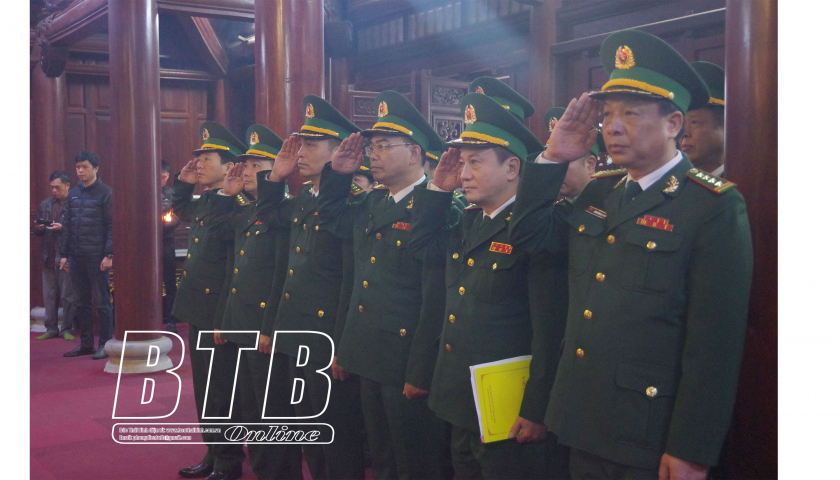 Border Guards offer incense to President Ho Chi Minh at his temple in Thai Binh