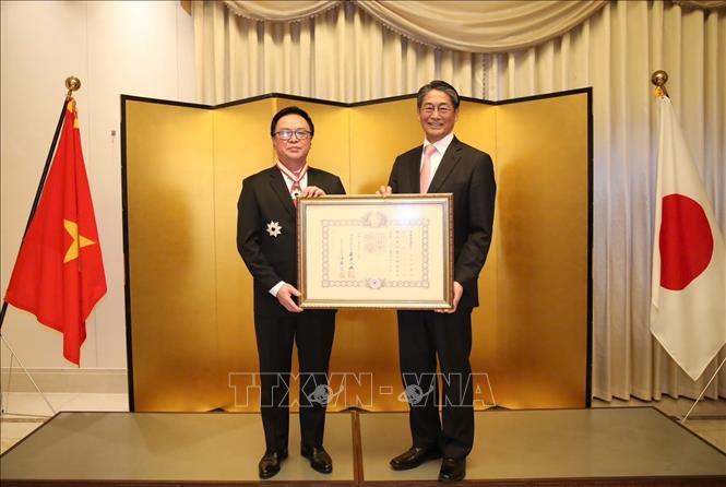 Party official receives Japan s Order of the Rising Sun