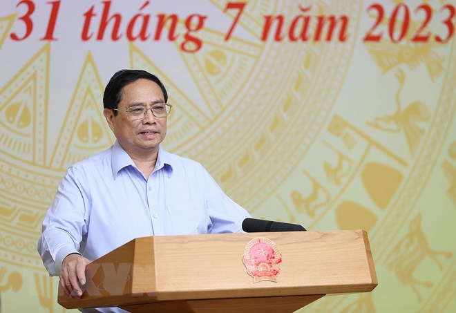 越南政府总理范明正主持召开全国县乡行政单位设置工作视频会议