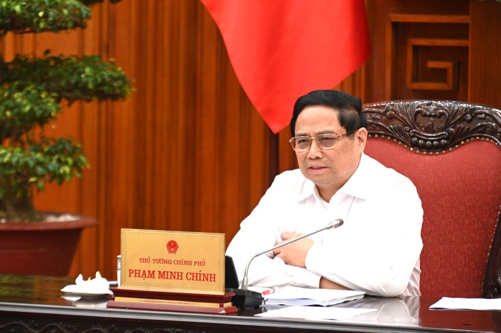 范明正总理主持召开越南国际与地区金融中心建设项目会议