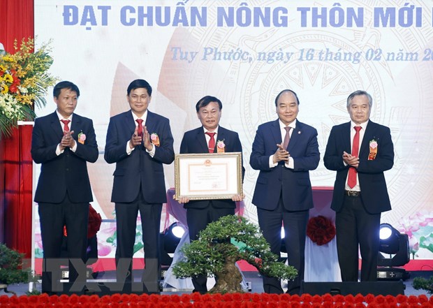 El presidente asiste a la ceremonia de reconocimiento de Tuy Phuoc de Binh Dinh como distrito rural de nuevo estilo